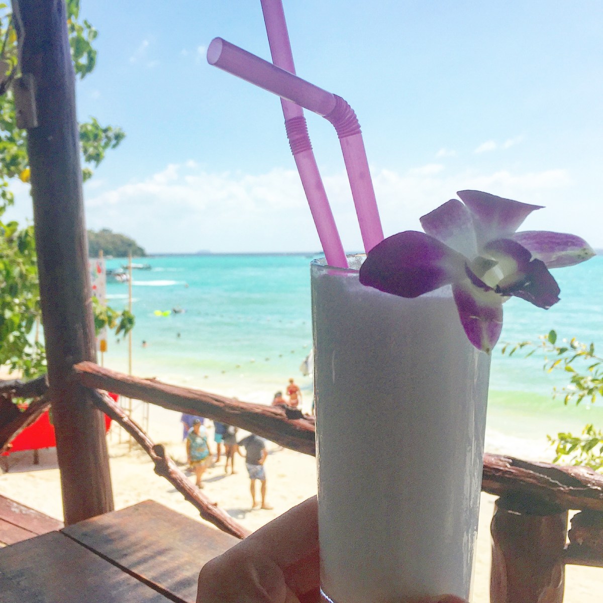 BBM KOREA | Ko Phi Phi Thailand | Enjoying a coconut smoothie in atop a treehouse bar.